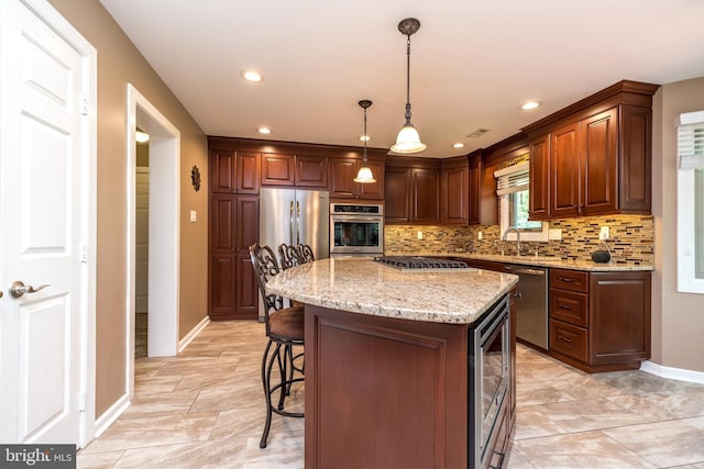 kitchen with light stone counters, beverage cooler, stainless steel appliances, baseboards, and tasteful backsplash