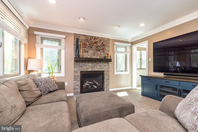 carpeted living area featuring baseboards, ornamental molding, recessed lighting, and a stone fireplace