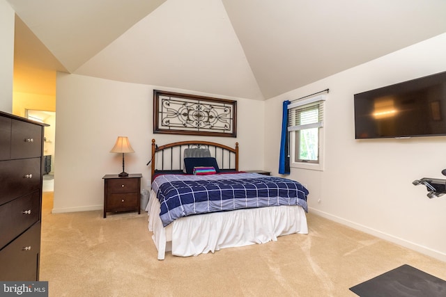 carpeted bedroom with baseboards and high vaulted ceiling