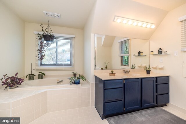 bathroom featuring a garden tub, tile patterned floors, visible vents, and vanity