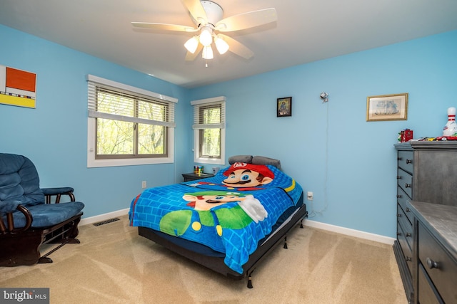 bedroom with visible vents, carpet flooring, and baseboards