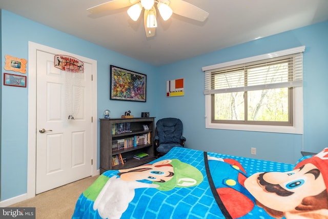 carpeted bedroom with a ceiling fan