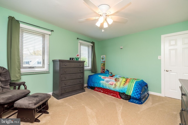 bedroom with baseboards, carpet flooring, and a ceiling fan