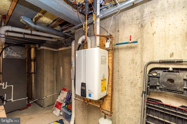 utility room with heating unit and tankless water heater