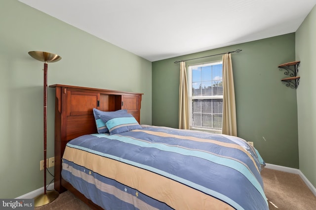 carpeted bedroom with baseboards
