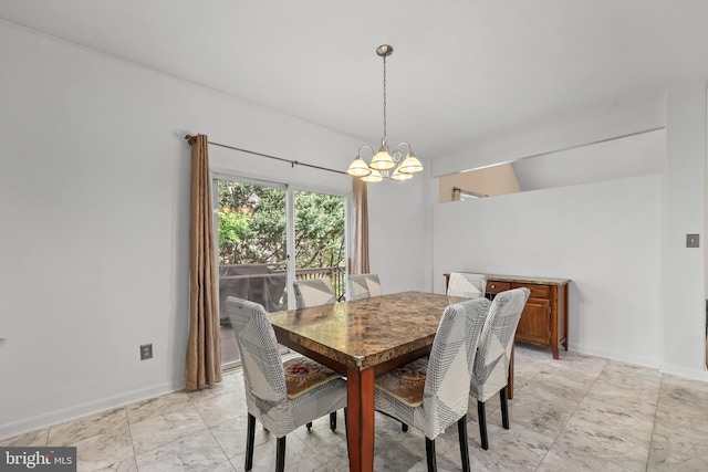 dining area with baseboards and a notable chandelier