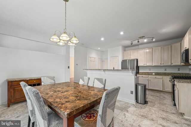 dining room featuring recessed lighting and a notable chandelier