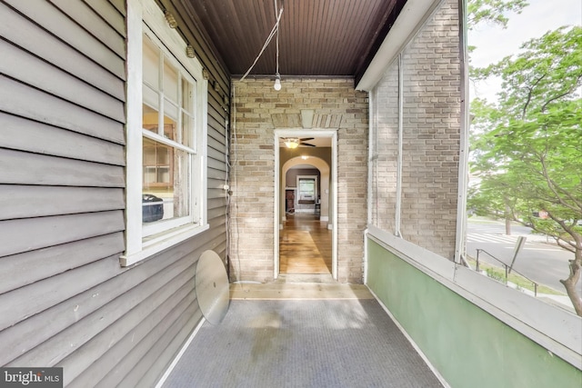 property entrance featuring brick siding