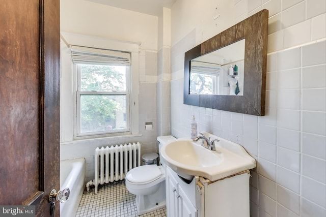 full bath featuring radiator heating unit, a healthy amount of sunlight, toilet, and tile walls