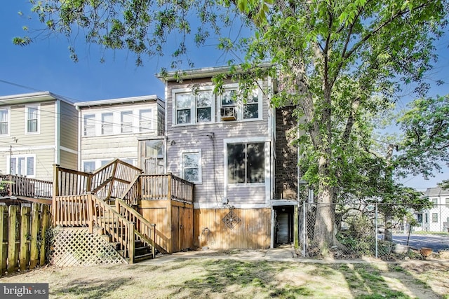 back of house with fence and stairs