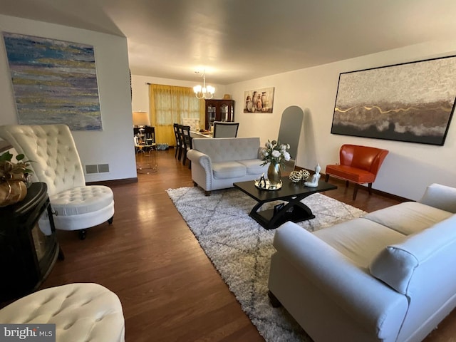 20416 Old York Rd, White Hall, MD 21161 - living room featuring baseboards, an inviting chandelier, wood finished floors, and visible vents