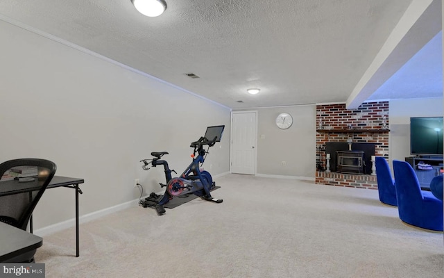 20416 Old York Rd, White Hall, MD 21161 - workout area with visible vents, a wood stove, a textured ceiling, and carpet floors