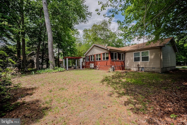 12 Woods Cir, Ocean View, DE 19970 - back of property with crawl space and a pergola