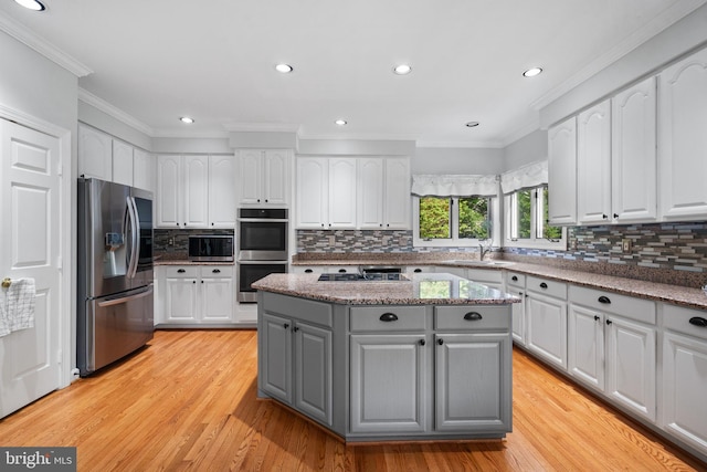 4209 Hardy Ridge Dr, Woodbridge, VA 22192 - kitchen with a sink, gray cabinets, stainless steel appliances, and white cabinets