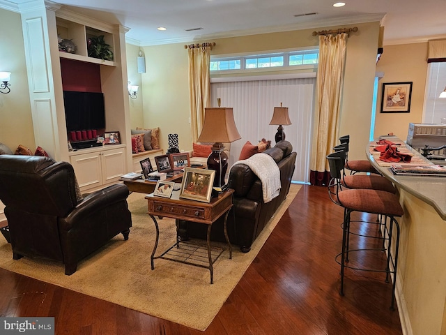 living area featuring crown molding, recessed lighting, dark wood-style flooring, and visible vents