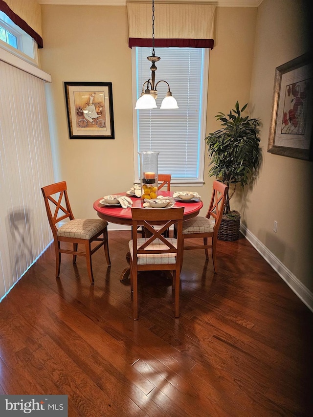dining area with wood finished floors and baseboards