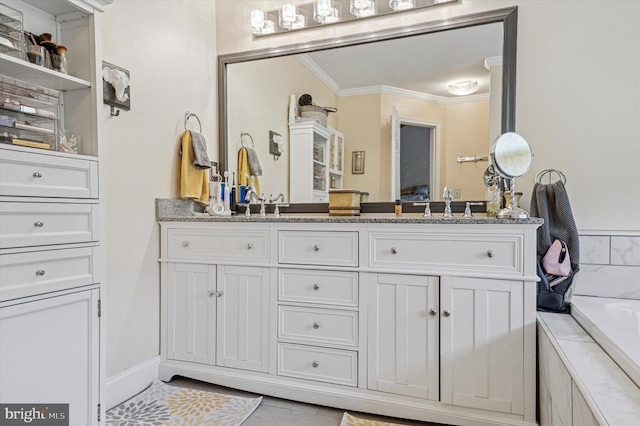 full bathroom with crown molding, vanity, tile patterned flooring, and a bathtub