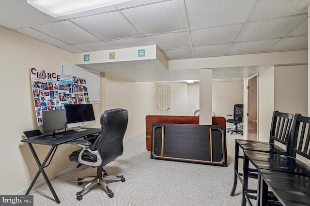 office area featuring carpet flooring and a drop ceiling