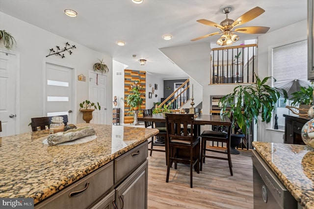 kitchen featuring a ceiling fan, light stone counters, recessed lighting, and light wood finished floors