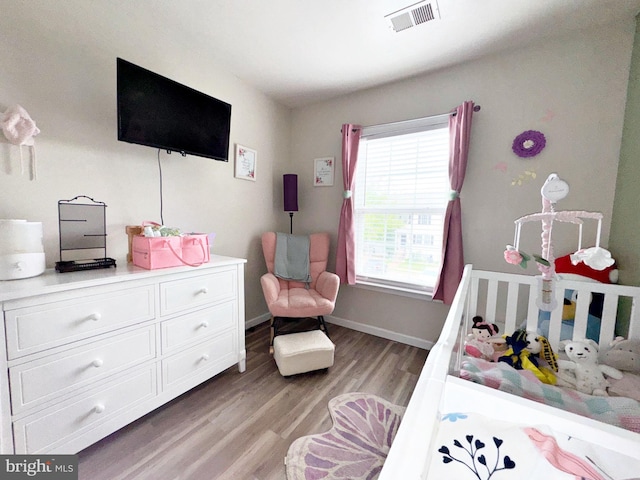 21 Holmes Dr, Charles Town, WV 25414 - bedroom featuring baseboards, visible vents, and light wood-style floors
