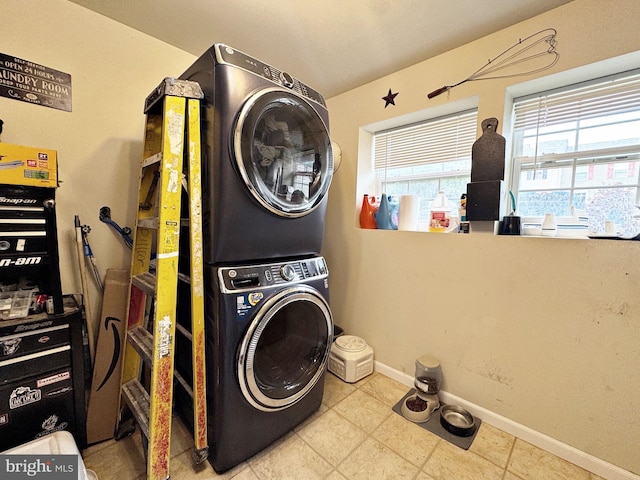 21 Holmes Dr, Charles Town, WV 25414 - washroom with baseboards, laundry area, and stacked washer / dryer
