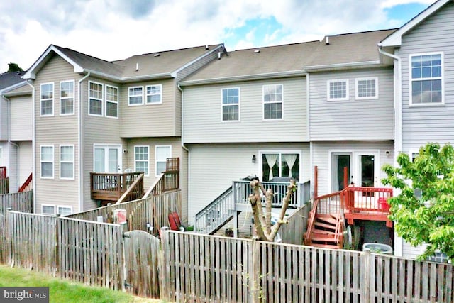 21 Holmes Dr, Charles Town, WV 25414 - rear view of house with a deck, stairs, and a fenced backyard