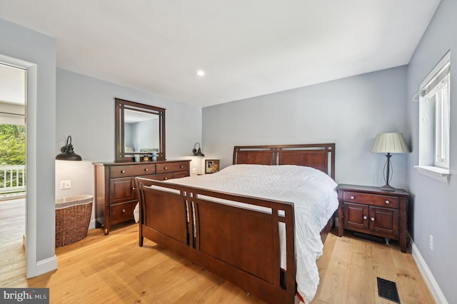 bedroom featuring baseboards, recessed lighting, light wood-style floors, and visible vents