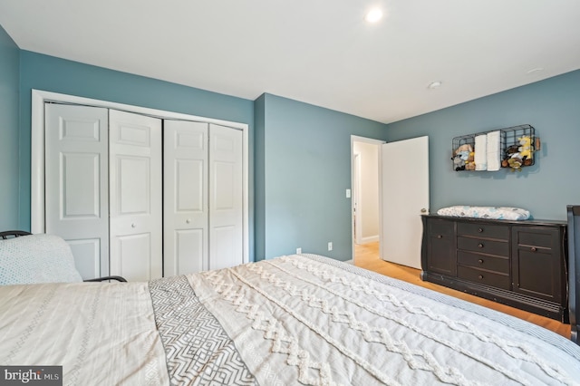 bedroom featuring a closet and wood finished floors