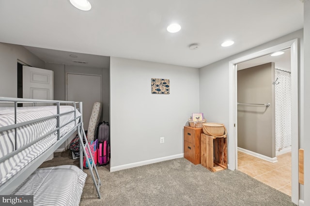 carpeted bedroom with baseboards, visible vents, and recessed lighting