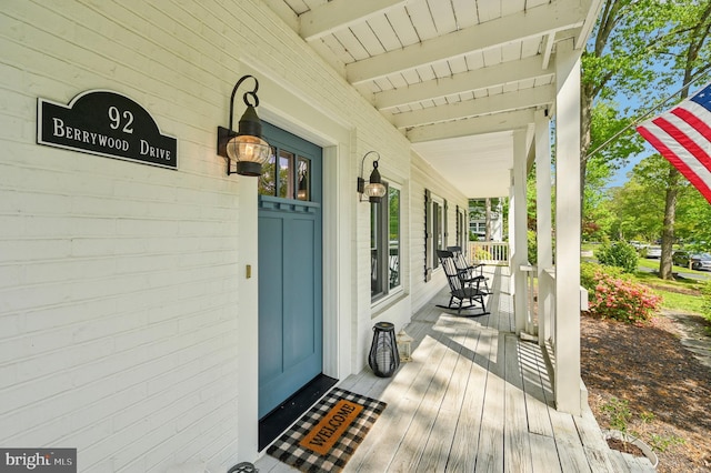 wooden terrace with covered porch