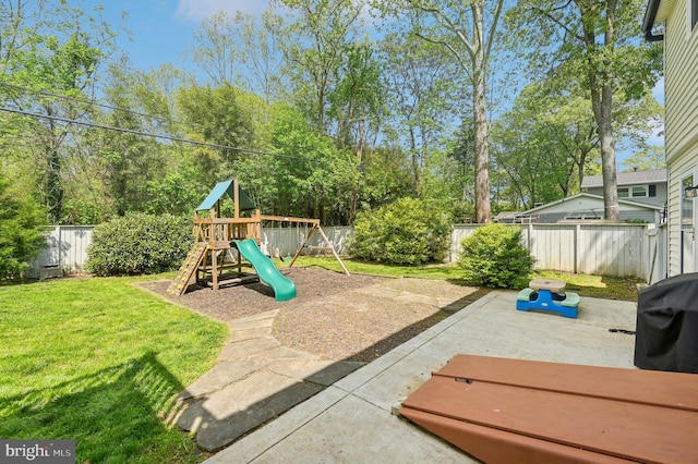 exterior space with a patio, a lawn, and a fenced backyard