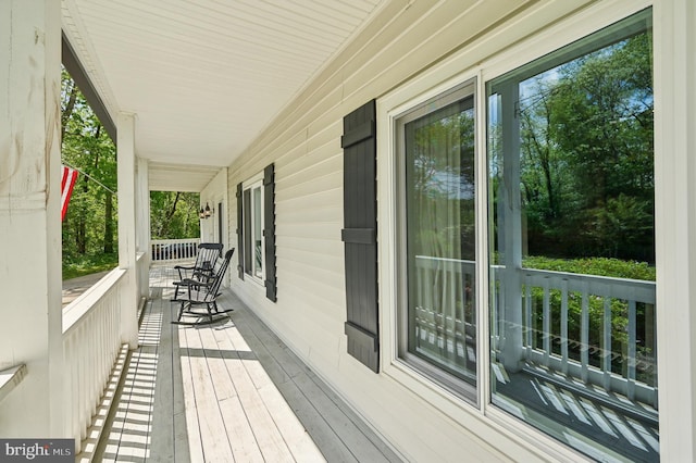 wooden terrace with a porch