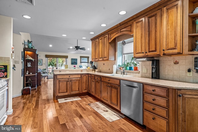 kitchen with stainless steel dishwasher, open shelves, brown cabinets, a sink, and a peninsula