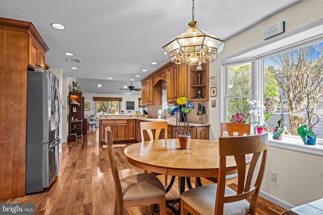 dining space featuring recessed lighting, baseboards, light wood-type flooring, and visible vents
