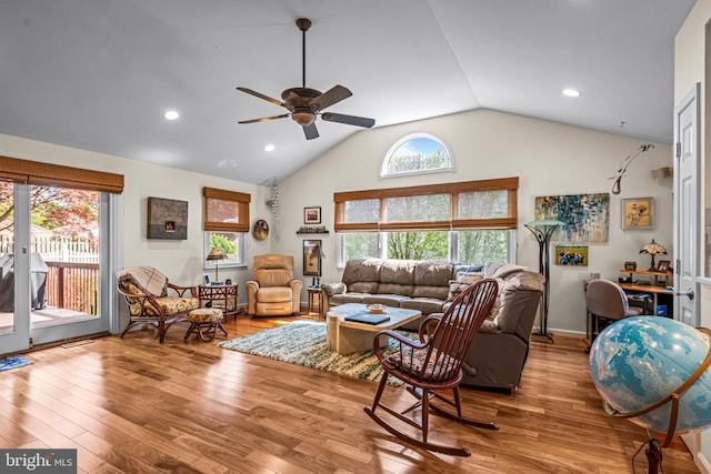 living room featuring ceiling fan, a healthy amount of sunlight, lofted ceiling, and wood finished floors