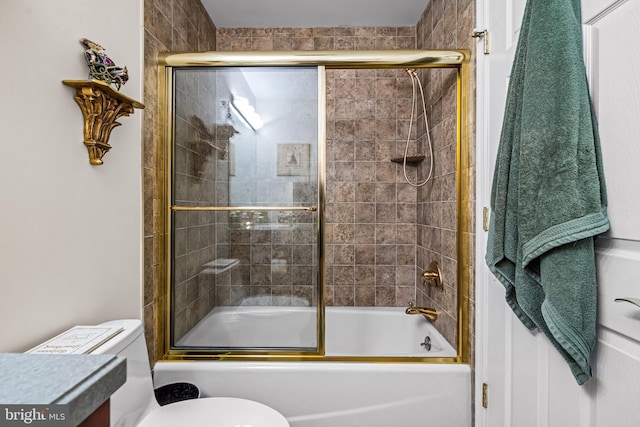 full bathroom with vanity, combined bath / shower with glass door, and toilet