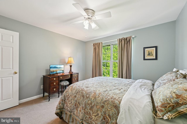 bedroom featuring carpet floors, baseboards, and a ceiling fan