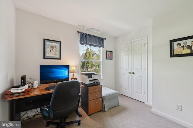 office area with light colored carpet and baseboards