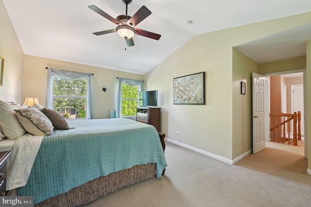 bedroom featuring carpet flooring, a ceiling fan, baseboards, and lofted ceiling