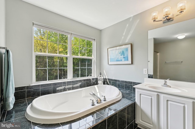 full bath featuring a garden tub and vanity