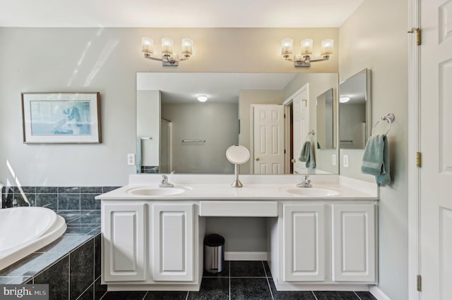 bathroom with double vanity, a sink, and tile patterned flooring