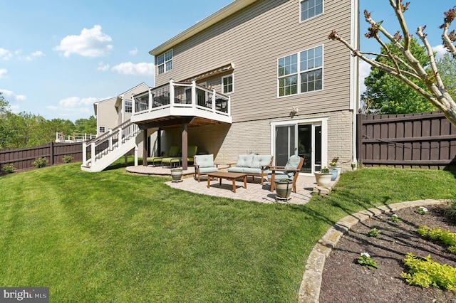 rear view of property with a wooden deck, a fenced backyard, an outdoor hangout area, a patio area, and a yard