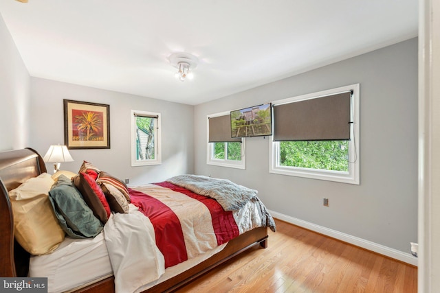 3015 Oregon Knolls Dr NW, Washington, DC 20015 - bedroom featuring baseboards and wood finished floors