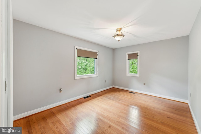 3015 Oregon Knolls Dr NW, Washington, DC 20015 - empty room with baseboards and hardwood / wood-style floors