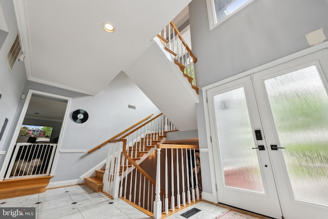 foyer entrance with stairs, french doors, visible vents, and recessed lighting