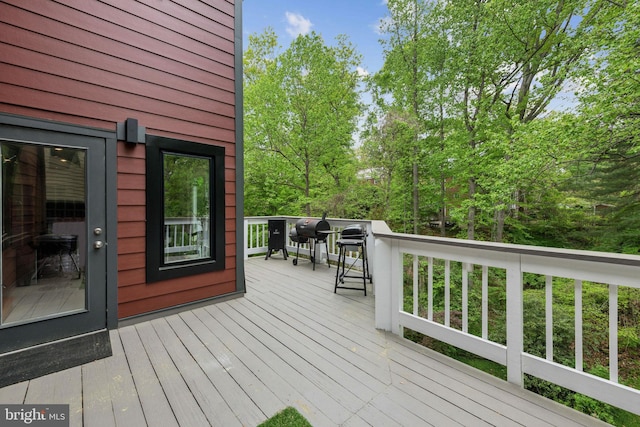 wooden deck featuring grilling area