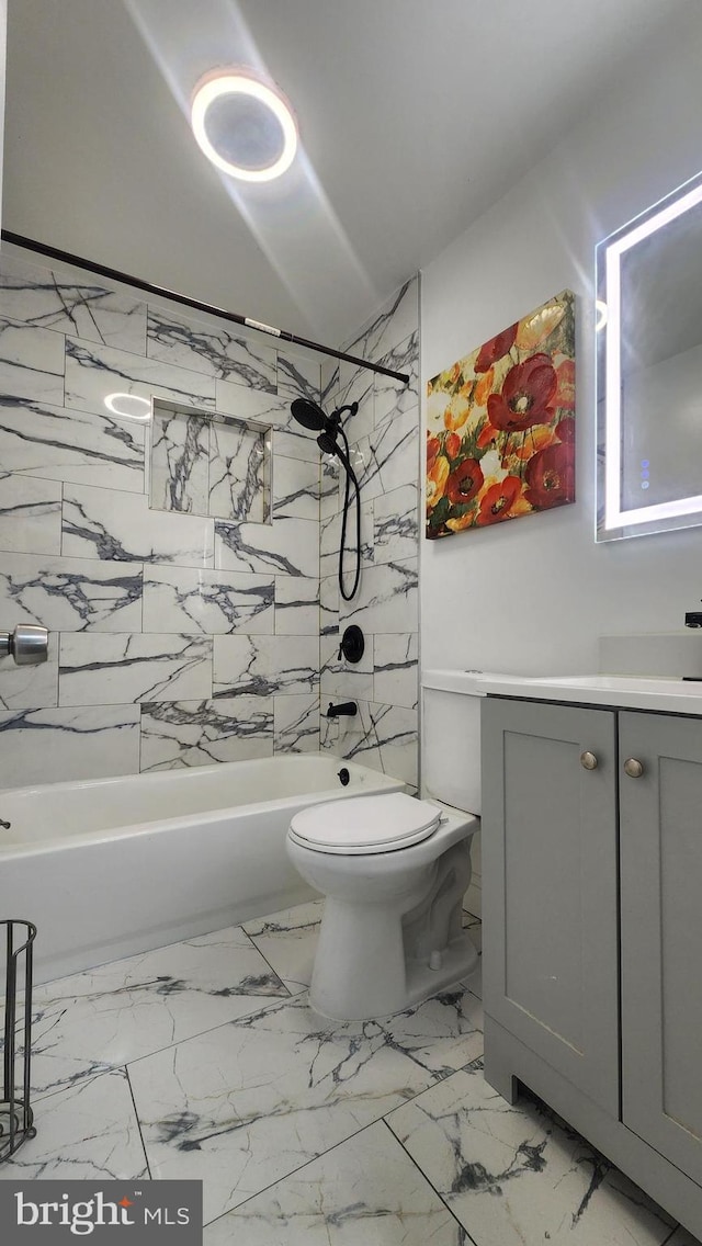 full bath with toilet, marble finish floor, shower / washtub combination, and vanity