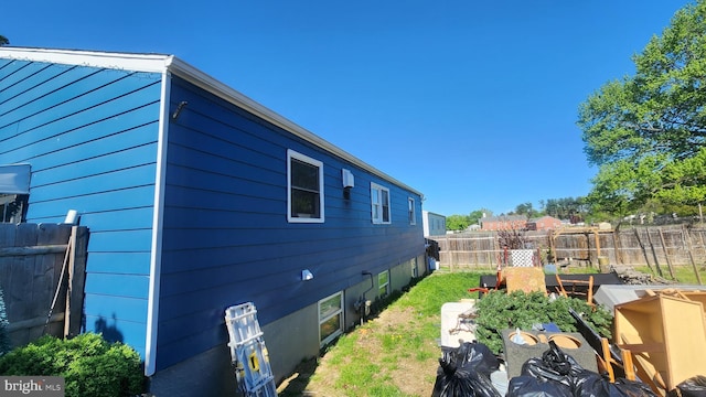 view of property exterior with a fenced backyard