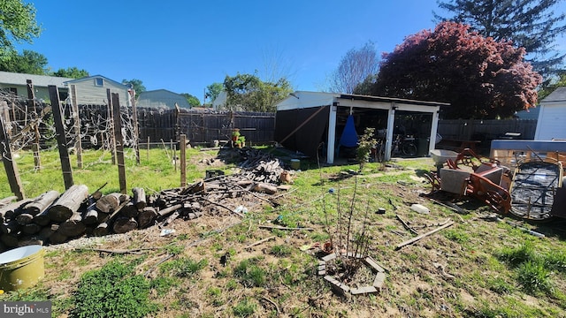 view of yard with an outbuilding and a fenced backyard