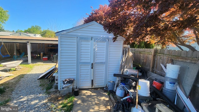 view of shed featuring a fenced backyard